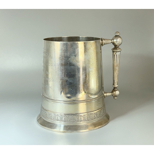 574 - A Christopher Dresser design for Elkington tankard trophy.Manufacturer marks to base, No. 14606 and ... 