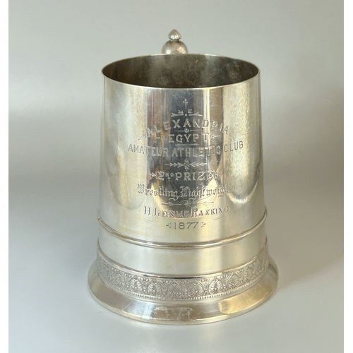 574 - A Christopher Dresser design for Elkington tankard trophy.Manufacturer marks to base, No. 14606 and ... 