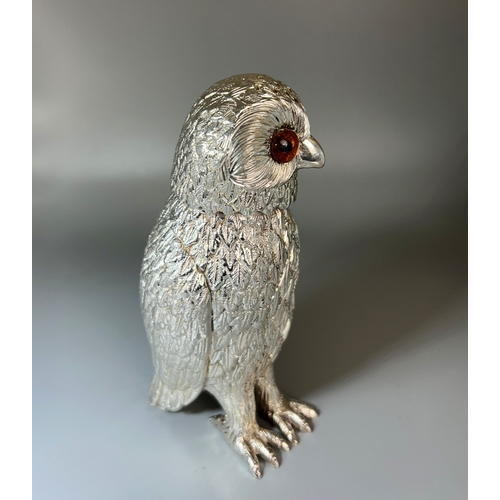 536 - A large silver plated 'Owl' sugar shaker.With amber coloured glass eyes.Height - 15cm