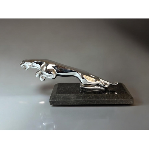 646 - Chrome plated Jaguar car mascot. Mounted on marble base.Length - 21cm (8.25