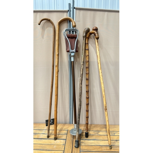 46 - Pair of vintage wooden walking sticks with curved handles. Includes a Gamebird brand shooting stick ... 