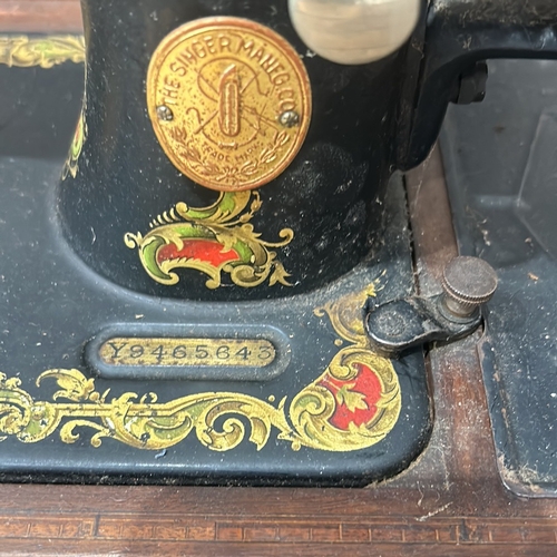 49 - Vintage Singer sewing machine with intricate floral decals and original wooden case, from the early ... 