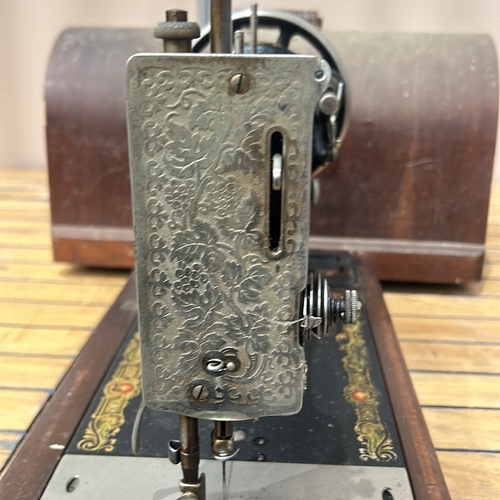 49 - Vintage Singer sewing machine with intricate floral decals and original wooden case, from the early ... 