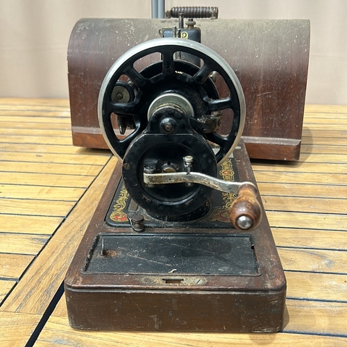 49 - Vintage Singer sewing machine with intricate floral decals and original wooden case, from the early ... 