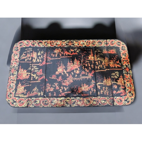 342 - A Regency period Chinese export lacquered games table.Circa 1830.Elaborately painted with typical Ch... 