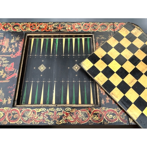 342 - A Regency period Chinese export lacquered games table.Circa 1830.Elaborately painted with typical Ch... 