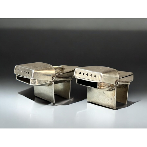 589 - Japanese export silver salt & pepper.Shaped as traditional Geta sandals.3 x 5cm