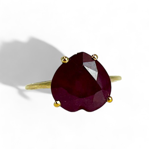 195 - A 10ct Gold & Ruby Heart shaped ladies ring.Large 'Heart' cut treated ruby. Size - S