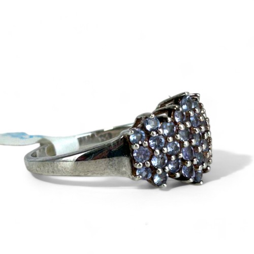 200 - A ladies Silver & Tanzanite cluster ring.Size - T