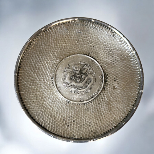 93 - A collection of five silver coin dishes.Including Spanish Reales and four Chinese examples. Diameter... 