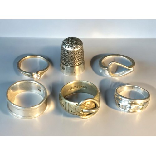 394 - Hall marked Silver Thimble, Persian Silver Belt Ring and 4 other Silver 925 Dress rings. Varying siz... 