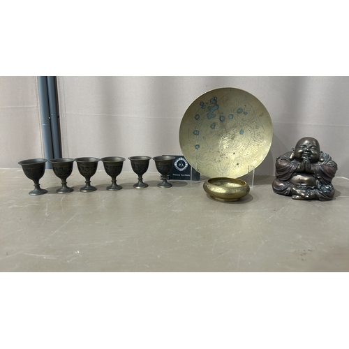 140 - Decorative bronze collection includes a Buddha figurine, engraved plate, small bowl, and six intrica... 