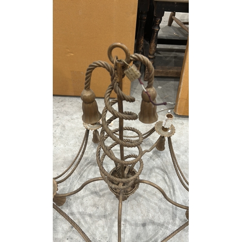 192 - Vintage wrought iron chandelier featuring twisted rope design, five candle holders, and ornate detai... 