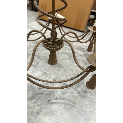 192 - Vintage wrought iron chandelier featuring twisted rope design, five candle holders, and ornate detai... 