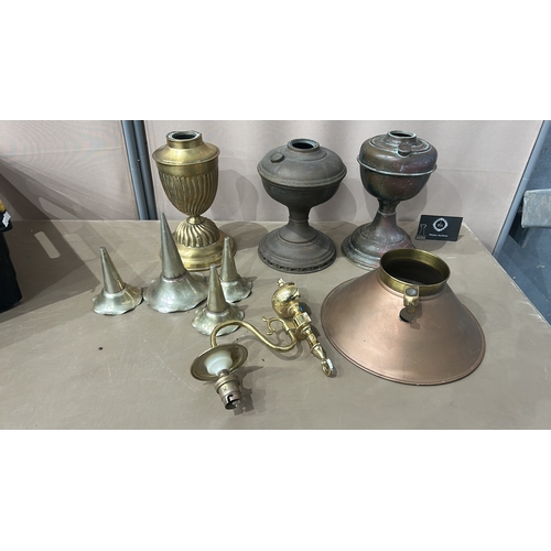 193 - Collection of vintage brass lamp components, including four burners and various fittings.