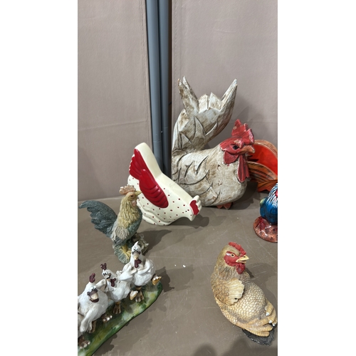 199 - Collection of ceramic chicken figurines, featuring various styles and vibrant colors. Includes a ran... 