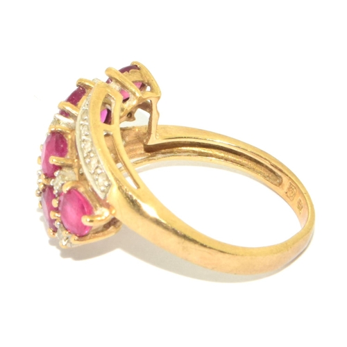 8 - 9ct gold ladies Ruby and Diamond twist ring size L