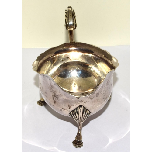 9 - Solid silver hallmarked 3 leg sauce boat set on hoof feet with a scroll handle 170grm