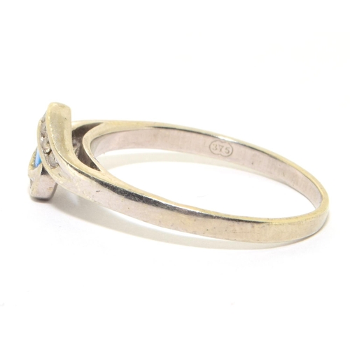 38 - 9ct white gold ladies Opal and Diamond twist ring size Q