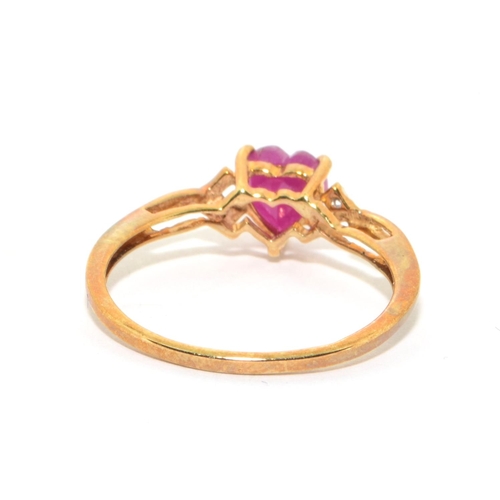 111 - 9ct gold ladies Ruby heart design ring with clear stone decoration size P