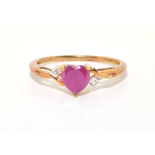 111 - 9ct gold ladies Ruby heart design ring with clear stone decoration size P