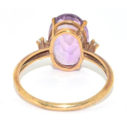 133 - 9ct gold ladies Amethyst statement ring set with Diamond to the shoulders size R