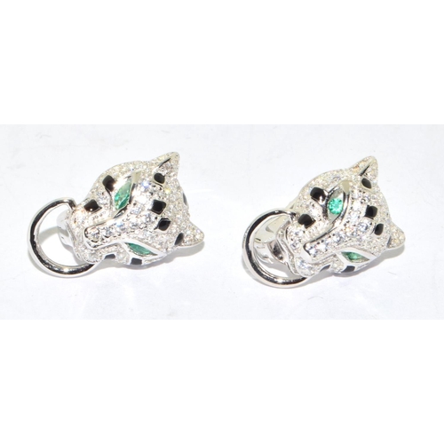 149 - Pair silver designer earrings with emerald eyes