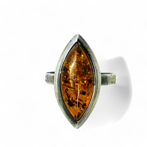 155 - A silver & amber ring.Size - P