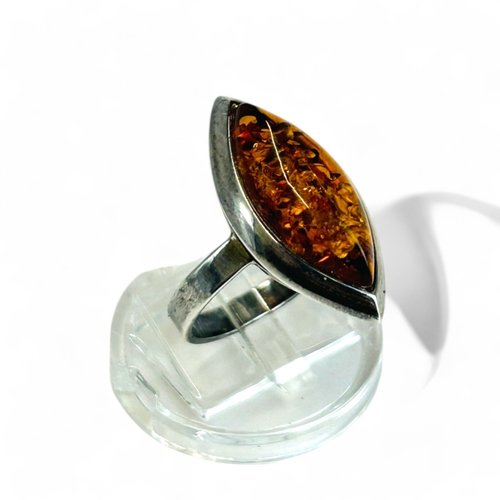 155 - A silver & amber ring.Size - P