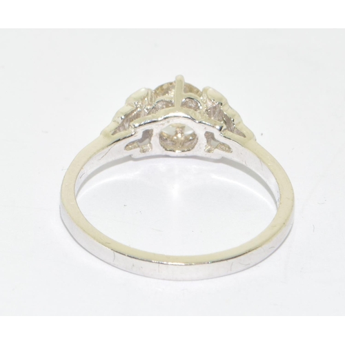 156 - 18ct white gold Diamond set ring the central stone flanked by graduated diamond shoulders size M