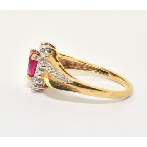 158 - 9ct gold ladies diamond heart design ring with a red Rubellite love heart centre stone size O