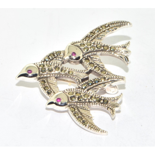 278 - silver and marcasite brooch in the form of three birds with ruby eyes