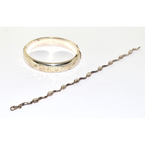 287 - Silver embossed bangle 7cm diameter together a silver clear stone fancy link bracelet 19cm long