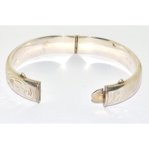 287 - Silver embossed bangle 7cm diameter together a silver clear stone fancy link bracelet 19cm long