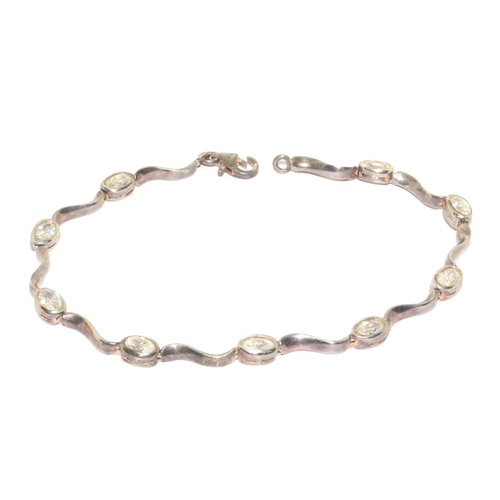 287 - Silver embossed bangle 7cm diameter together a silver clear stone fancy link bracelet 19cm long