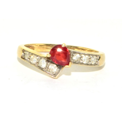 296 - 9ct gold ladies vintage Diamond and Ruby cross over ring size N