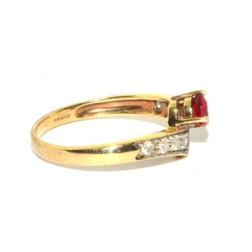 296 - 9ct gold ladies vintage Diamond and Ruby cross over ring size N