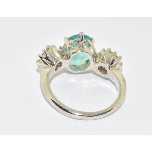 321 - Substantial 18ct white gold Emerald and Diamond  three stone ring  of approx 5.5cts size O