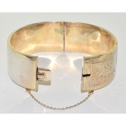 322 - Large 925 silver Embossed solid bangle with safety chain 7cm diameter 2.5cm wide 65grm