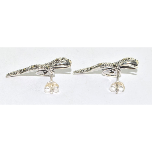 327 - Pair of marcasite snake earrings with garnet eyes