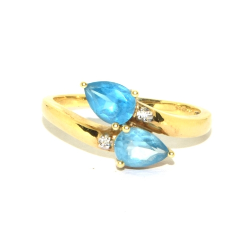 336 - 9ct gold ladies Aquamarine and accent Diamond shoulder twist design ring size T