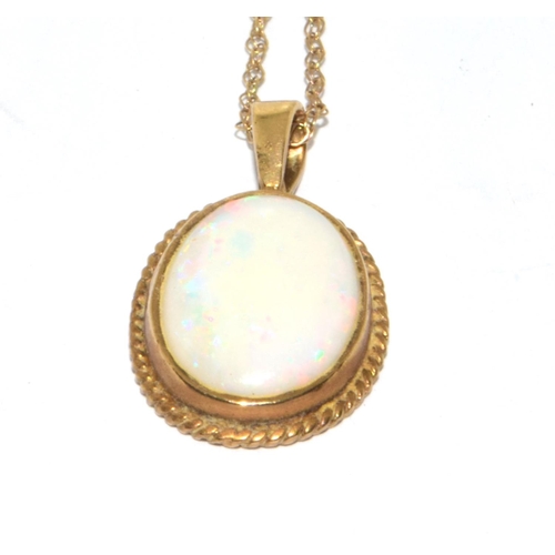 358 - 9ct gold large Opal oval pendant necklace set in a scroll setting on a 46cm gold chain