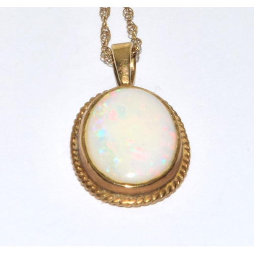 358 - 9ct gold large Opal oval pendant necklace set in a scroll setting on a 46cm gold chain