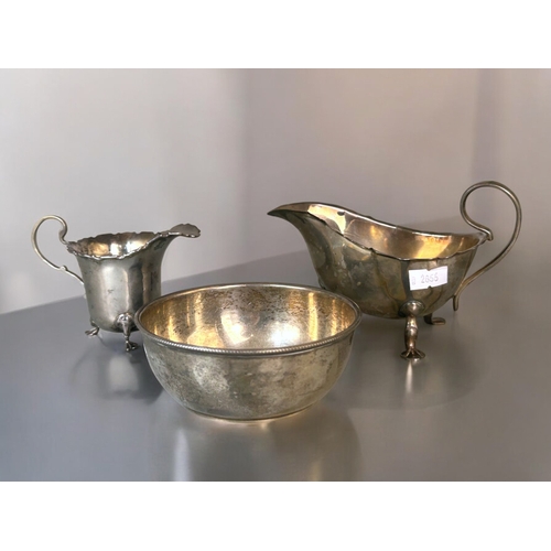 622 - A collection of sterling silver.Including a Mappin & Webb silver bowl, gravy boat and milk jug. ... 