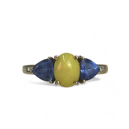 576 - A 9ct Gold, Opal & Tanzanite ring.Accented with diamonds to shoulder.Size - S