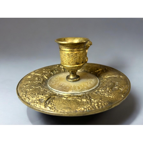 613 - A French Gilt bronze & Mother-of-Pearl Chamberstick.Late 18th / 19th century.Embossed 'Hunt' sce... 