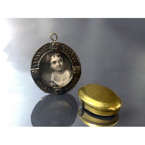 637 - A Georgian brass 'wrigglework' decoration snuff box. Together with a 19th century framed engraving o... 