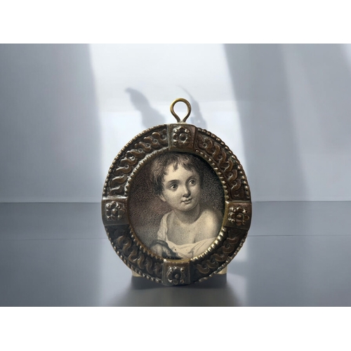 637 - A Georgian brass 'wrigglework' decoration snuff box. Together with a 19th century framed engraving o... 