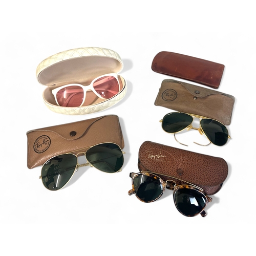 287 - Four pairs of Ray Ban sunglasses, with cases.