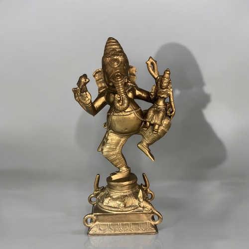 617 - A large Bronze figure of dancing Ganesh.Early 20th century.Re-gilded. Height - 29.5cm... 